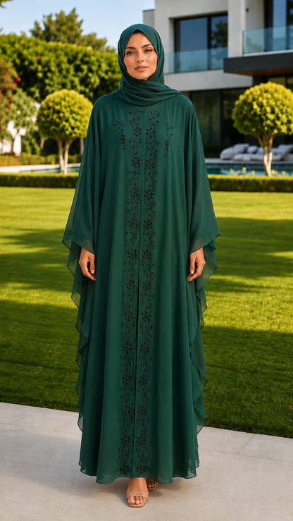 Emerald green beaded abaya with matching hijab for women by Rayyan & Co. with flowing cape sleeves and embellished front design