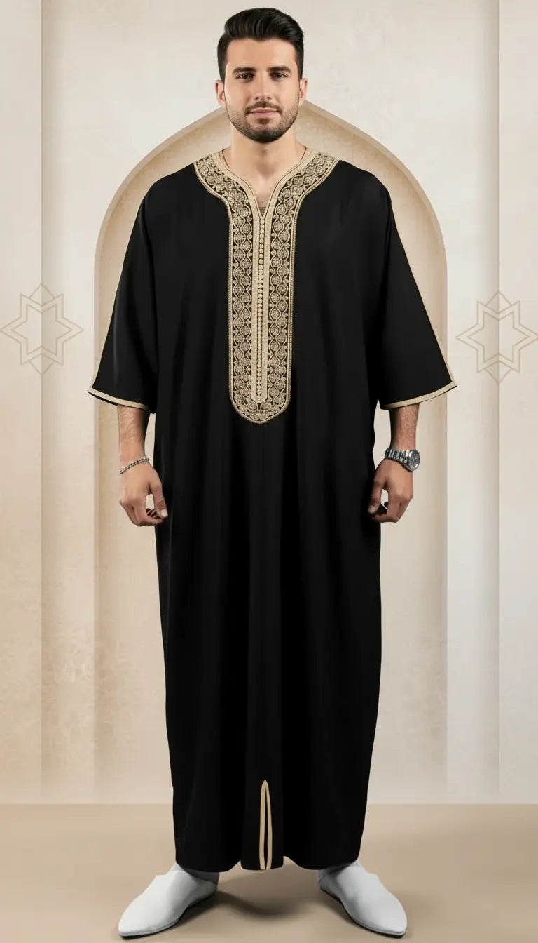 Imran Elite black embroidered men’s thobe by Rayyan & Co. with elegant gold detailing