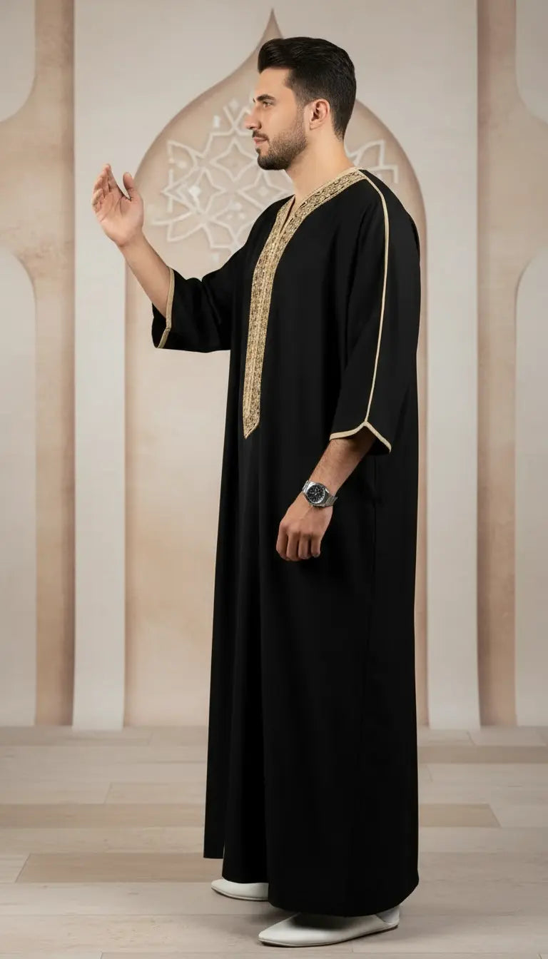 Imran Elite black embroidered men’s thobe by Rayyan & Co. with elegant gold detailing